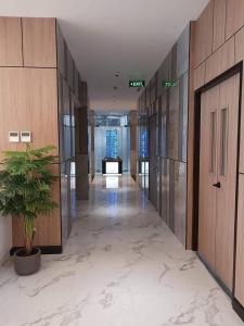 a hallway of an office building with a potted plant at J Tower Residences in Mandaue City +20 photos