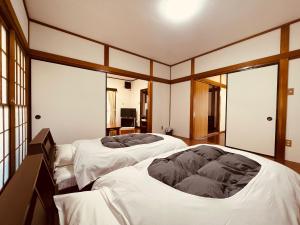 Postel nebo postele na pokoji v ubytování 楓リゾート鬼怒川温泉 优雅宽敞的日式独栋旅馆