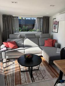 a living room with a couch and a table at Nomad Laryssiou on camping GT Keiheuvel parcel 371 in Balen
