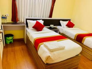 Letto o letti in una camera di Hotel Odyssey Nepal