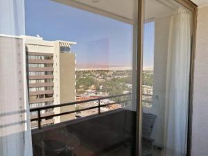 a balcony with a view of a city at Céntrico Dpto Calama in Calama
