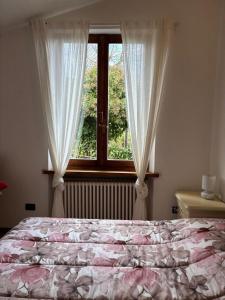 Postel nebo postele na pokoji v ubytování Antica Fiera + 10 fotografií