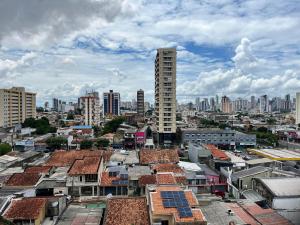a view of a city with buildings and roofs at Apto estratégico COP30 in Belém