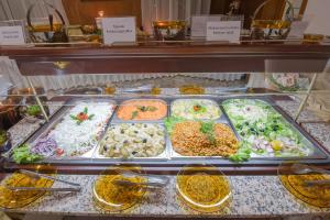 a display case with many different types of food at Hotel Prespa in Pamporovo