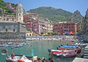 a group of boats in a body of water with buildings at B&B Casa Celsi in La Spezia