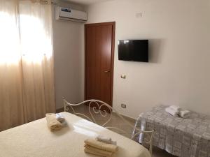 Ένα ή περισσότερα κρεβάτια σε δωμάτιο στο Residenza Filippo Tropea