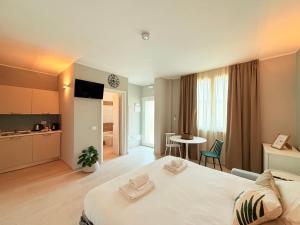 En eller flere senge i et værelse på Il Giardino degli Ulivi P1