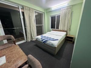 A bed or beds in a room at Hotel Shivaya
