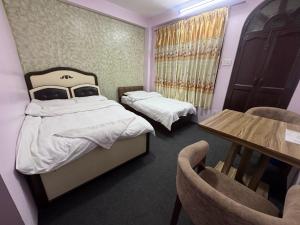 A bed or beds in a room at Hotel Shivaya