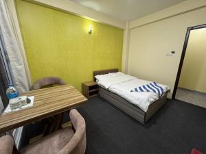 Postel nebo postele na pokoji v ubytování Hotel Shivaya