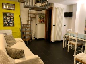 a living room with a couch and a table at Affittacamere Monterosso 5 Terre in Monterosso al Mare