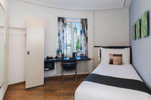 Letto o letti in una camera di Hotel Bristol Zurich