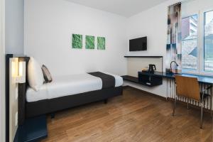 Letto o letti in una camera di Hotel Bristol Zurich