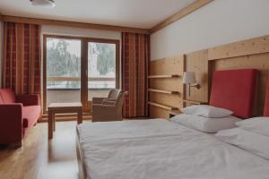 Postel nebo postele na pokoji v ubytování Hotel Marten - Joker Card Partner
