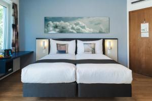 Letto o letti in una camera di Hotel Bristol Zurich