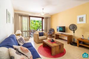 Μια τηλεόραση ή/και κέντρο ψυχαγωγίας στο Reserva Imbassaí - Apto TD 3 102 Buganvílias