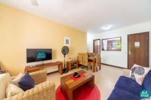 Μια τηλεόραση ή/και κέντρο ψυχαγωγίας στο Reserva Imbassaí - Apto TD 3 102 Buganvílias