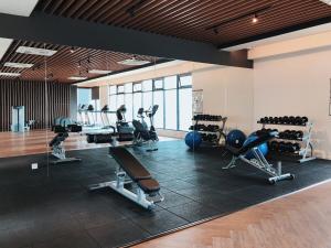 a gym with treadmills and exercise equipment in it at Emira Residence Seksyen 13 Shah Alam by Alpha LaVista in Shah Alam