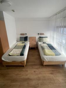 A bed or beds in a room at Center Hostel and Guest House