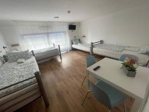 A bed or beds in a room at Center Hostel and Guest House