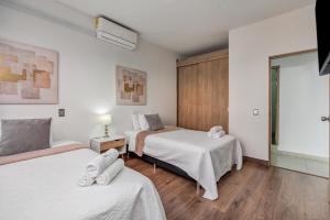 Ένα ή περισσότερα κρεβάτια σε δωμάτιο στο Luxury Penthouse Con Aire acondicionado