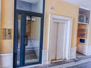 a doorway to a building with a glass door at Tra Onde & Vicoli - Parcheggio PRIVATO in Porto Recanati +33 photos