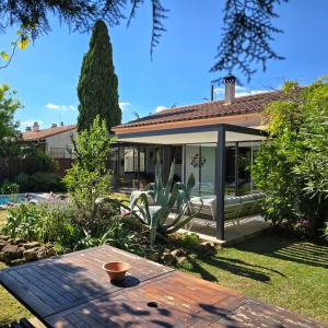 Κήπος έξω από το Maison Climatisée, Jardin, Piscine, 7 pers