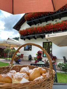 a basket of pastries sitting on top of a table at Casa Mia in Moieciu de Sus