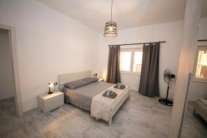 Postel nebo postele na pokoji v ubytování Casa LoiS