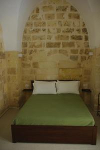 Ένα ή περισσότερα κρεβάτια σε δωμάτιο στο Casa Ninì