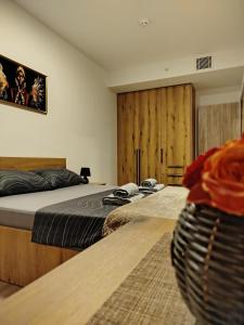 two beds in a room with at 18th & 16h Floor Secure Luxury Condos With Pool & Fitness Included In Price in Skopje