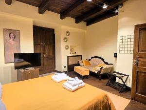 a living room with a bed and a couch at Domus Telesio Bed & Breakfast in Cosenza