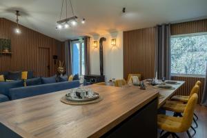 a living room with a dining table and a couch at Tzànnou farm residence in Mytilene