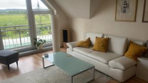 a living room with a couch and a table at Experience peace and quiet enjoy space in Münster