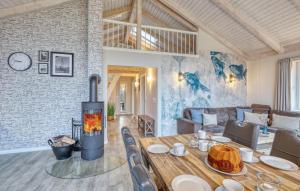 a living room with a wood burning stove at 2 Bedroom Amazing Home In Dagebüll in Dagebüll