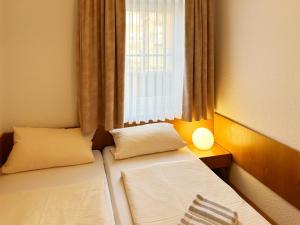 Postel nebo postele na pokoji v ubytování Haus Südspitze 18 Ferienwohnung Sand & Seele