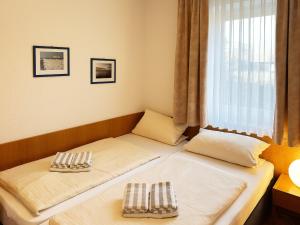 Postel nebo postele na pokoji v ubytování Haus Südspitze 18 Ferienwohnung Sand & Seele
