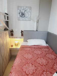 a bedroom with a bed with a red blanket at Sebastian Luxury House in Rhodes Town