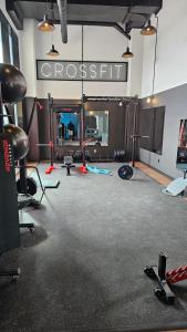 a gym with several exercise equipment in a room at Dream Apartment in Longueuil