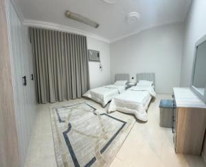 Postel nebo postele na pokoji v ubytování درة المدينة المنورة