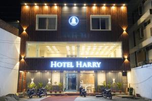 a hotel harry with motorcycles parked outside of it at Hotel Harry in Rishīkesh