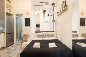 Letto o letti in una camera di Tiny & Tidy Studio in the key area of Milan
