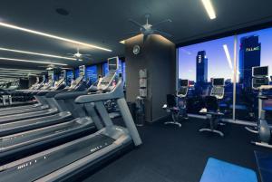 a gym with cardio machines and a view of the city at Palms Place- Strip View- High floor- Free parking in Las Vegas
