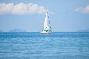 a sailboat in the middle of the water at Best Western Hotel Blumarea in Castelsardo