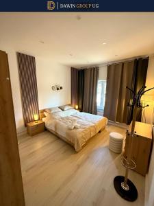 a bedroom with a large bed in a room at LUXURY 3 Room Apartment in Hanover- Dawin Group UG in Hannover