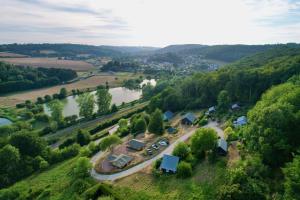 an aerial view of a village with a river at Coqslitscaux in Colleville