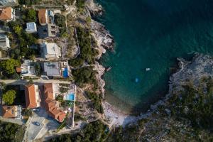 an aerial view of a beach with houses and the ocean at Apartment Veslo in Begovići