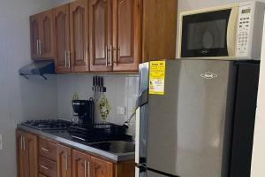 Kuchyň nebo kuchyňský kout v ubytování Apartamento de lujo en Mocoa