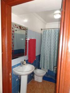 a bathroom with a sink and a toilet at Manis Apartment Set in a Hotel Area in Marrakesh