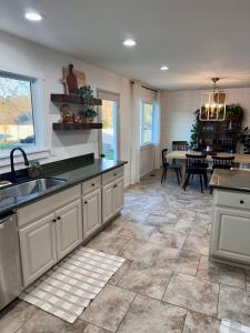 a kitchen with a sink and a counter top at Pool, Sauna, Spa, & Fire-pit in Ukiah